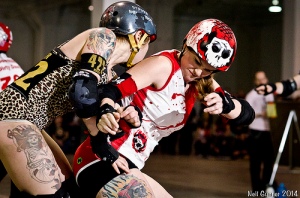 An intense shot of intense action by Neil Gunner. Another focus in the book is on roller derby's evolution from spectacle to sport. 