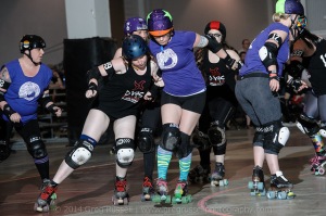 D-VAS blocker Juggernaut J attempts to slow Lindsay jammer UnAlish'D. (Photo by Greg Russell)
