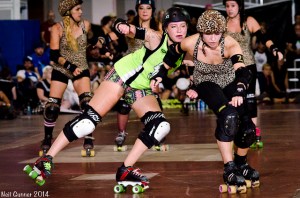 Gores jammer Lexi Con (evading a hit from Joss Wheelin) led the game in scoring with 91 points, including 59 in the opening half. (Photo by Neil Gunner)