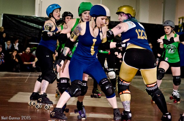 Bruisers pivot Monster Muffin works with Lucid Lou to contain Mangles the Clown. (Photo by Neil Gunner)