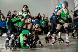 Bruisers' jammer Wolverina is involved in a pile up with the Brute-Leggers' pack. (Photo by Joe Mac)
