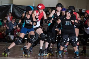 Betties' pivot LowBlowPalooza had another strong game (blocking here with Genuine Risk and Mazel Tough). (Photo by Greg Russell)