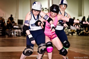 Boston jammer Maya Mangleyou duels with Toronto's Renny Rumble while Lil Paine looks on. (Photo by Neil Gunner)