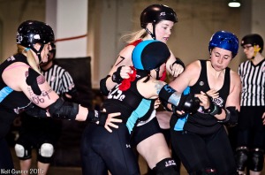 Betties blockers (l to r) Brickhouse Bardot, SewWhat?, and Jammher'head Shark contain Dolls jammer Common Dominator. (Photo by Neil Gunner)